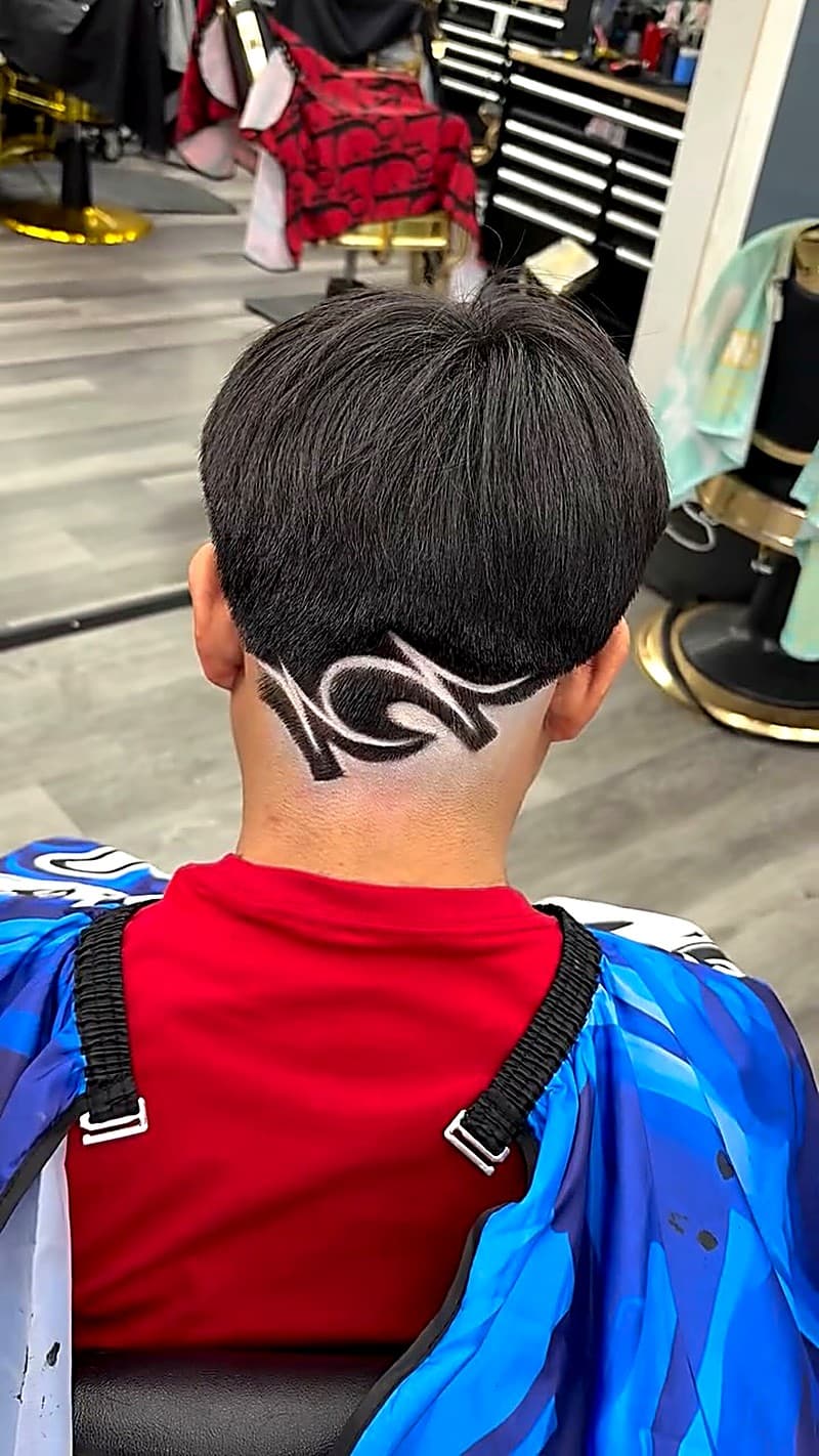 Back of head hair design — artistic carving and line work